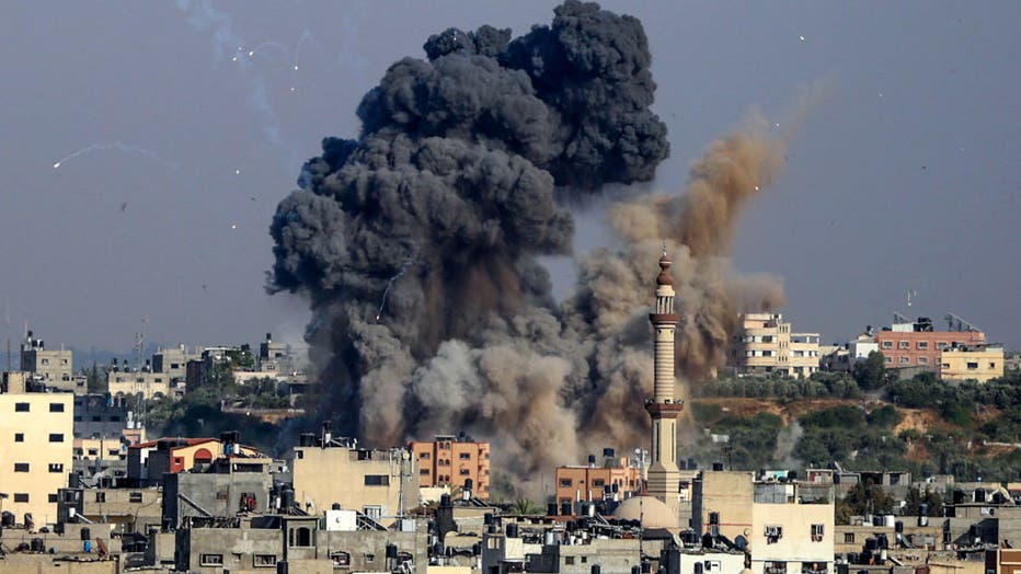 Smoke billows from Israeli air strikes in Gaza City, controlled by the Palestinian Hamas movement, on May 11, 2021. (Photo by ANAS BABA/AFP via Getty Images)