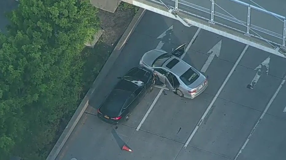 The driver of a grey Toyota Camry rammed the vehicle on the West Side Highway into a police cruiser. Photo shows stolen vehicle. Unclear if dark-colored vehicle belongs to NYPD.