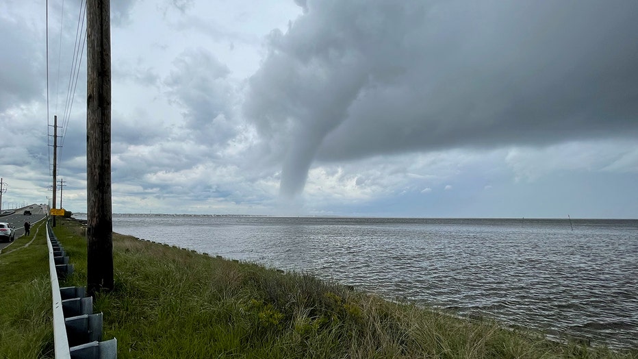 A waterspout over a bay