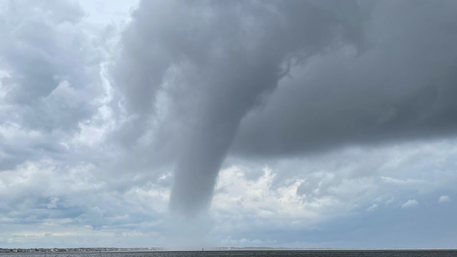 Waterspout and clouds