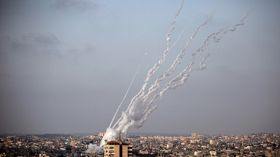 Rockets are launched from the Gaza Strip towards Israel, Monday, May. 10, 2021. (AP Photo/Khalil Hamra)