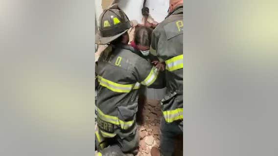 Girl stuck in dressing room pulled through wall to safety