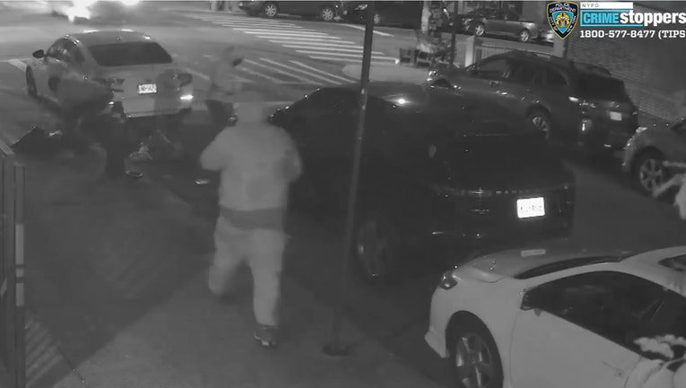 Men are seen picking up drugs that were thrown from the roof of a Brooklyn building.