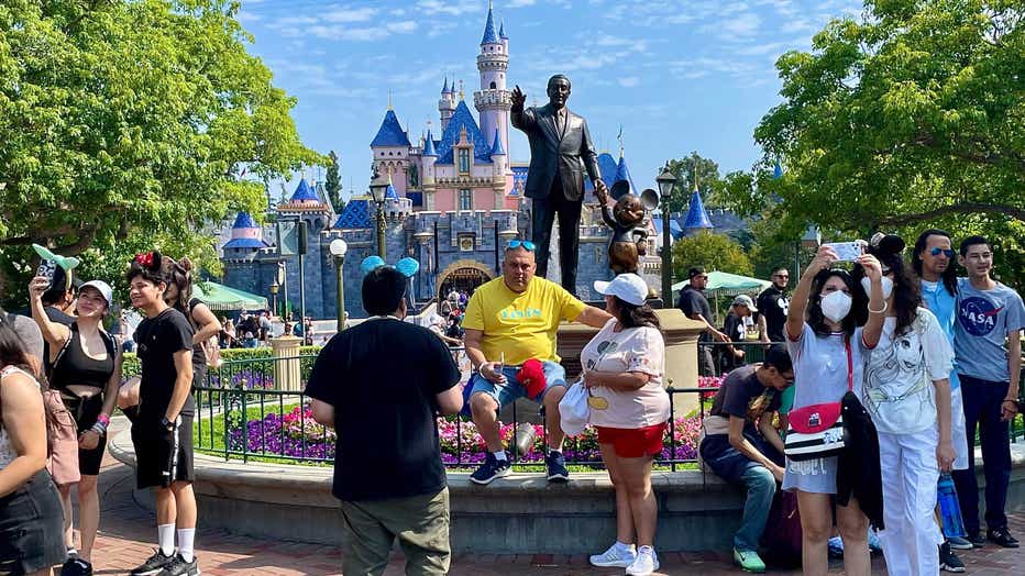 Disneyland walt disney statue snow white castle covid
