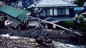 Japan mudslide: 4 dead, dozens missing as rescue crews search through debris