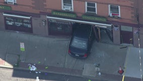 Car runs over mom and baby, crashes into barbershop
