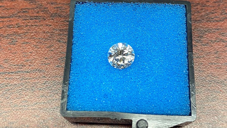A TSA agent at JFK Airport found a missing diamond from the engagement ring of a newlywed couple traveling to Guam.
