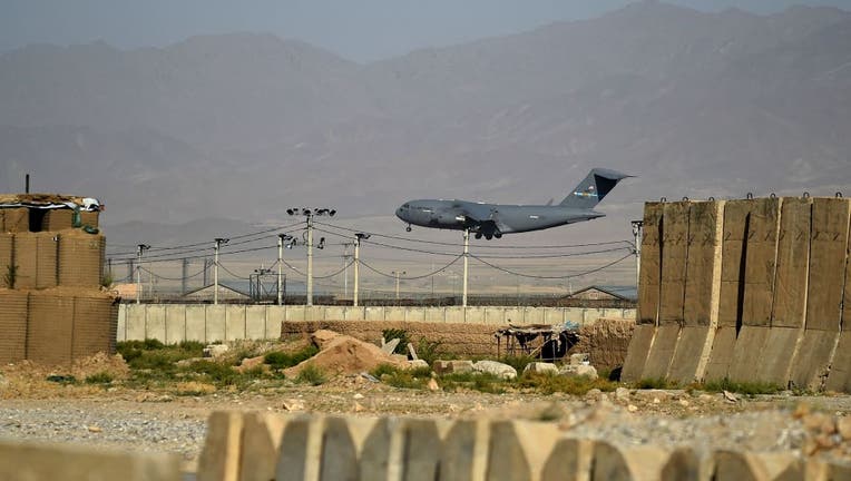 A US Air Force transport plane lands at the Bagram Air Base in Bagram on July 1, 2021. (Photo by WAKIL KOHSAR / AFP) (Photo by WAKIL KOHSAR/AFP via Getty Images)