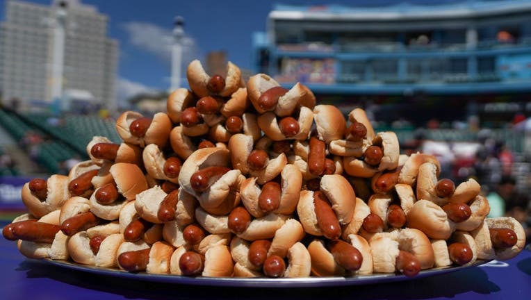 Hot dogs are prepared for the 2021 Nathan's Famous 4th Of July International Hot Dog Eating Contest on July 4, 2021 in New York City.