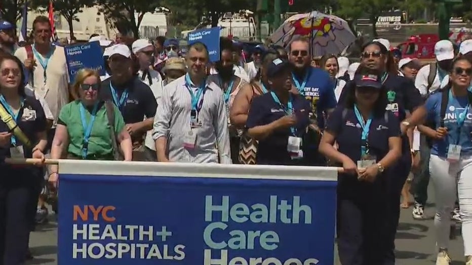 Health care workers from NYC Health + Hospitals march in the Hometown Heroes Parade.