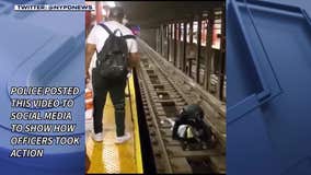 Cop, bystander jump on subway tracks to save unconscious man