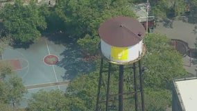 NYPD, graffiti artist in 12-hour-long standoff at Brooklyn water tower