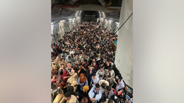 Hundreds of Afghans pack US military plane to escape Taliban control