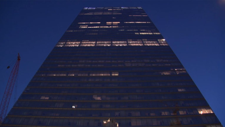 Skyscraper soars into the late evening sky seen from below