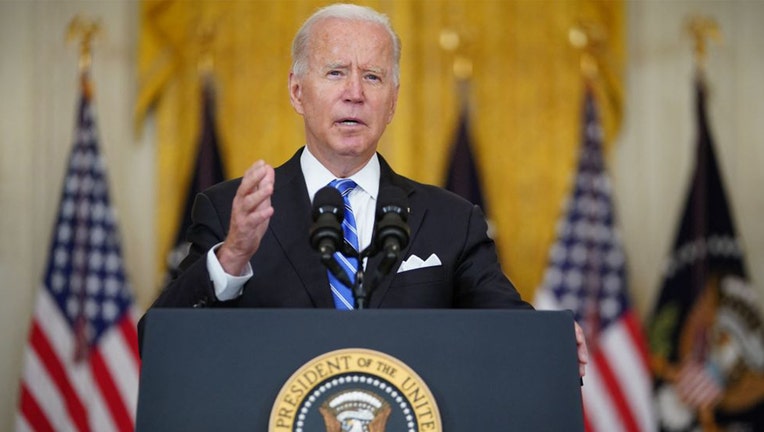 FILE - US President Joe Biden speaks in the East Room of the White House in Washington, DC, on Aug. 11, 2021. (Photo by MANDEL NGAN/AFP via Getty Images