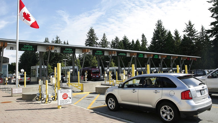 Cars line up at border crossing booths