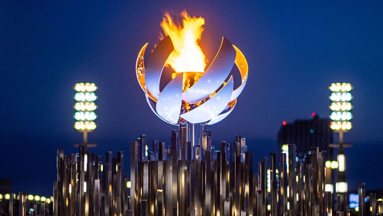 The Olympic flame is seen burning on the cauldron at Ariake Yume-no-Ohashi Bridge in Tokyo on July 25, 2021 during the Tokyo 2020 Olympic Games. (Photo by PHILIP FONG/AFP via Getty Images)