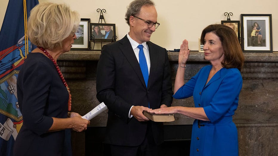 August 24, 2021 - Albany, NY - Governor Kathy Hochul is sworn-in as New York State's 57th Governor by Chief Judge Janet DiFiore during a midnight ceremony at the New York State Capitol. First Gentleman Bill Hochul holds the Bible.