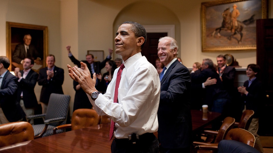 president-barack-obama-vice-president-joe-biden-and-senior-staff-applaud-in-the-roosevelt-room-of-the-white-house-as-the-house-passes-the-health-care-reform-bill.jpg