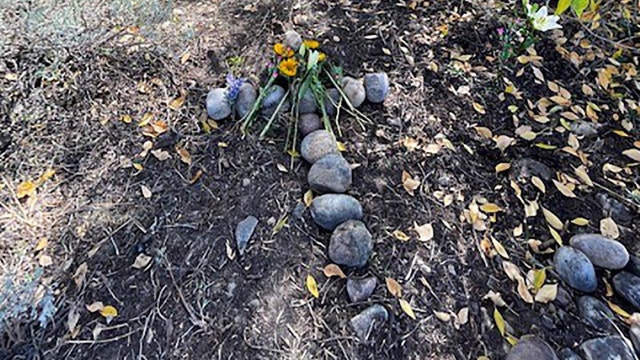 Gabby Petito's stepfather lays stone cross at spot where remains were found