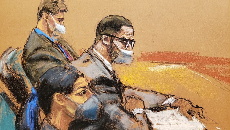 Courtroom sketch shows R. Kelly, wearing glasses and a mask, sitting with two lawyers at a table