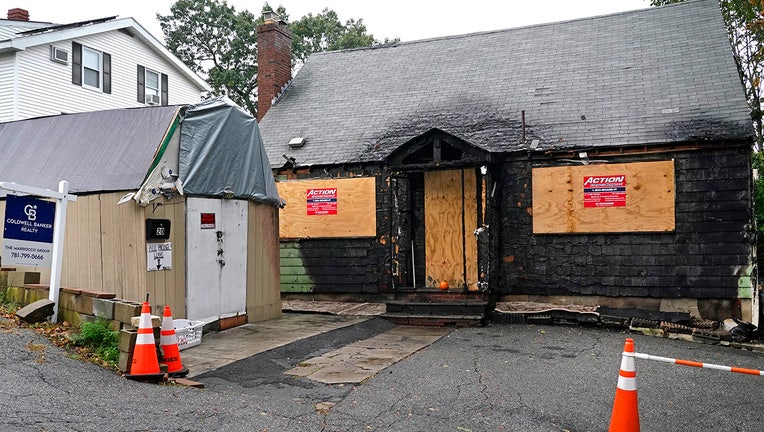 A home that was seriously damaged by fire is seen, Tuesday, Sept. 28, 2021, in Melrose, Mass. (AP Photo/Elise Amendola)