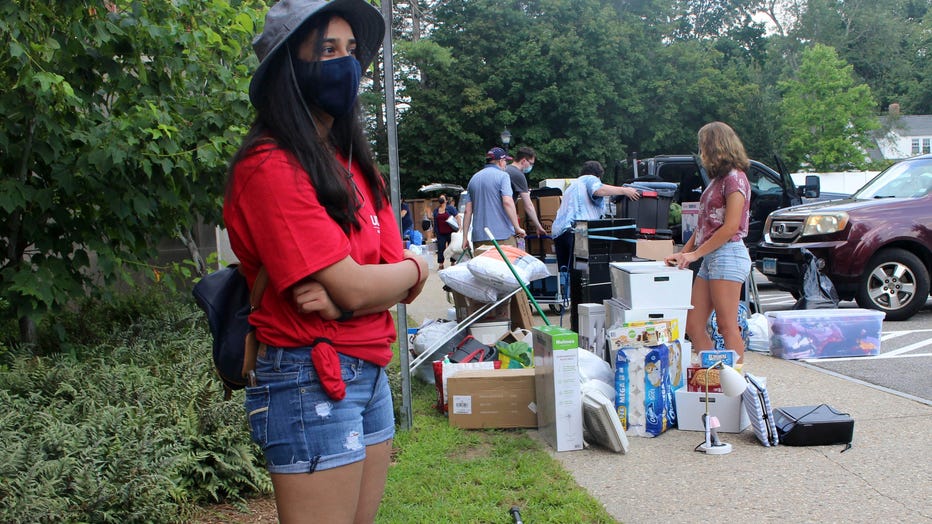 UConn sophomore Sahiti Bhyravavajhala assists students moving into Shippee Hall on the Storrs, Conn. campus, Friday, Aug. 27, 2021.