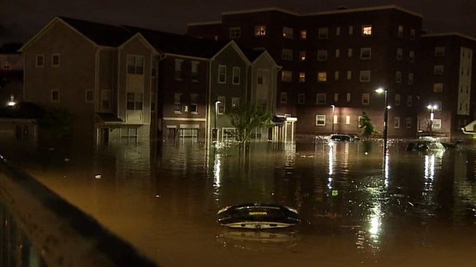 A flooded residential area, car submerged
