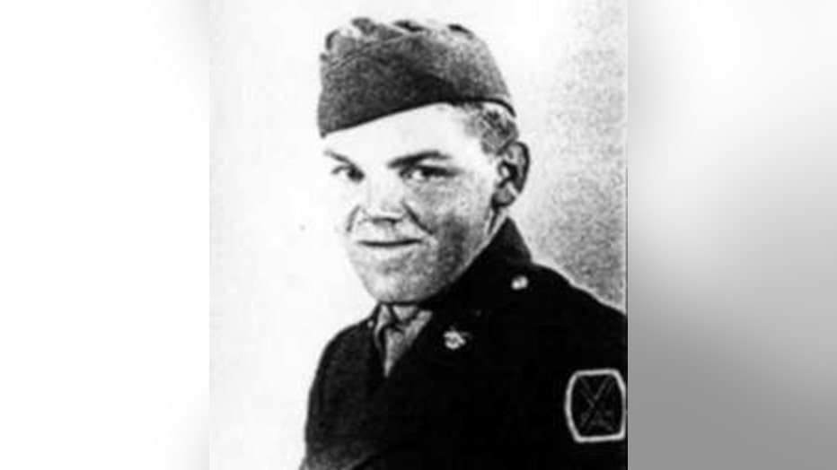 Grainy black-and-white photo of a soldier in uniform