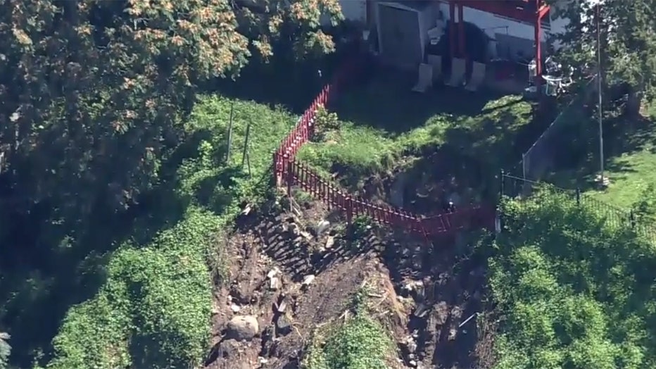 Aerial view of a collapsed backyard of a suburban home