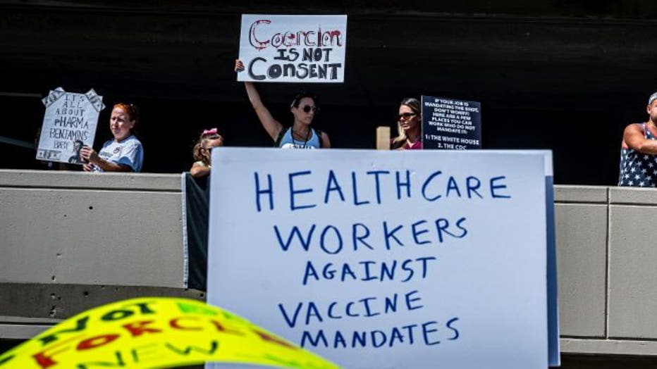 f694007e-Healthcare workers unite against mandated vaccines at Stony Brook Hospital on Long Island