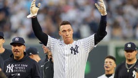 Judge delivers in 9th, Yanks clinch playoff spot in final AB