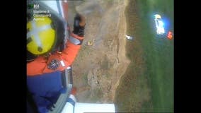 UK coast guard rescues 2 people clinging to cliff