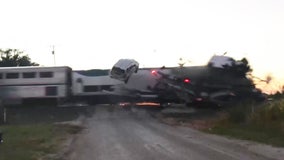 Dramatic video shows Amtrak train crashing into semi-truck car hauler in Oklahoma
