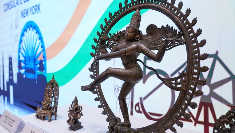 Some of the stolen objects being returned to India, including this bronze Shiva Nataraja valued at $4 million, are displayed during a ceremony at the Indian consulate in New York, Thursday, Oct. 28, 2021. U.S. authorities have returned about 250 antiquities to India in a long-running investigation of a stolen art scheme.