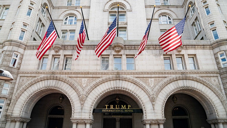 Face of Trump Hotel with 5 Americans flags