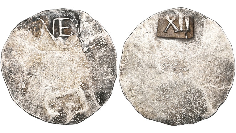 Closeup photos of both sides of a rare colonial-era coin