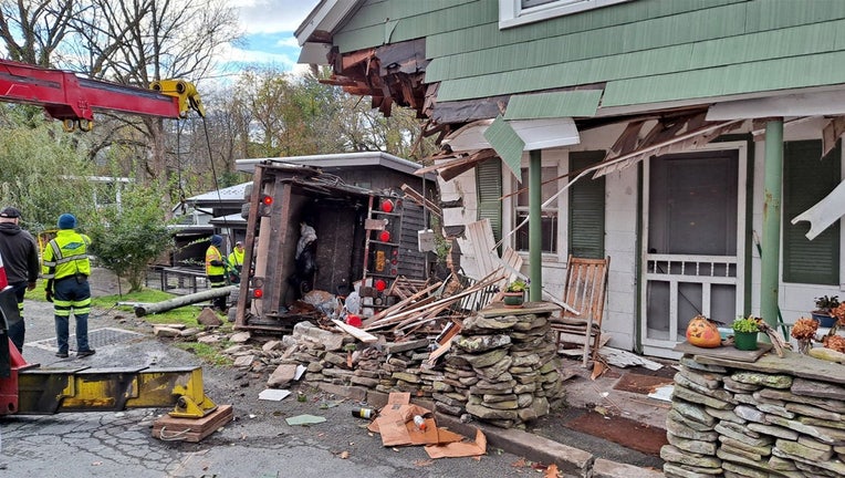 A photo released by the New York State Police shows the aftermath of a truck crashing into a home. (New York State Police)