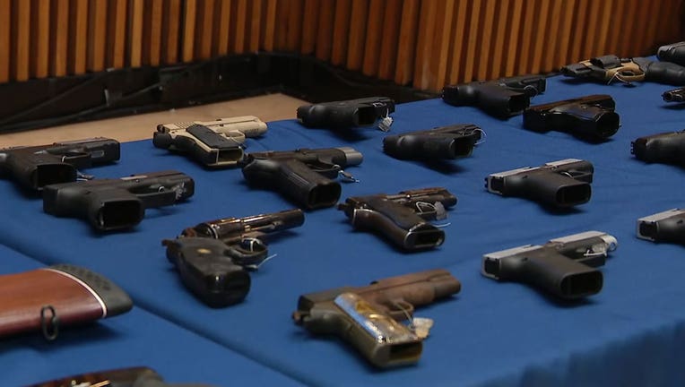 The NYPD displayed some of the guns they say a doorman sold from the building where he worked.