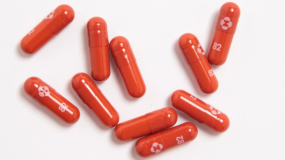 10 red capsules with while markings