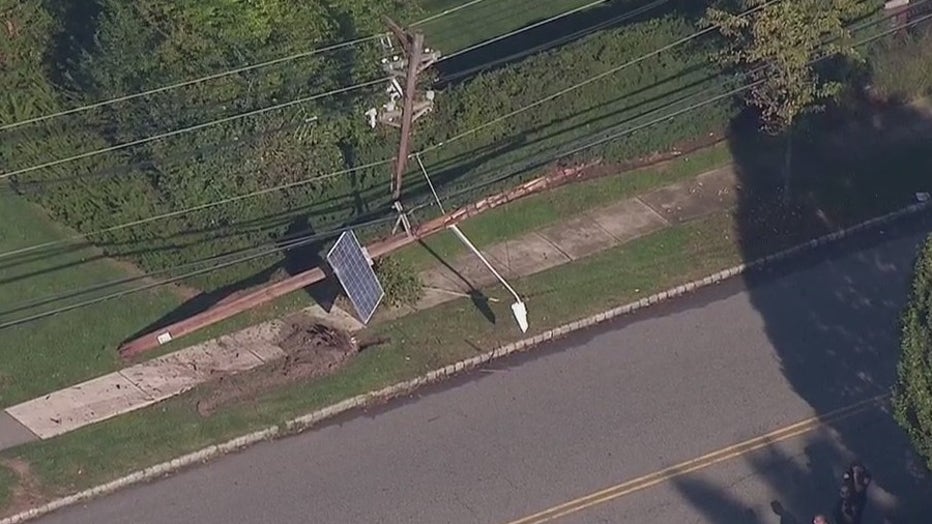 What remained of the pole with a solar panel attached could be seen on the ground behind the bus. 