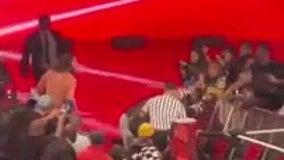 WWE wrestler Seth Rollins tackled by fan during 'Monday Night Raw' at Barclays Center