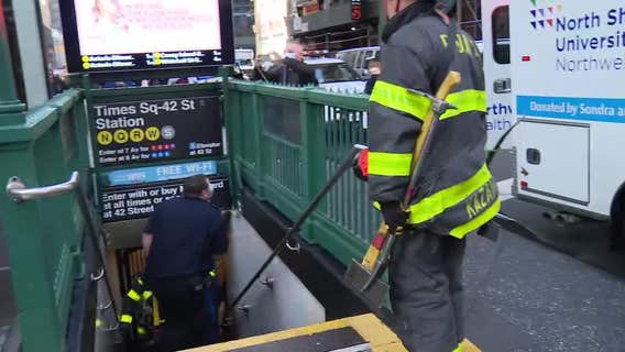 Woman pushed onto tracks at Times Square subway station