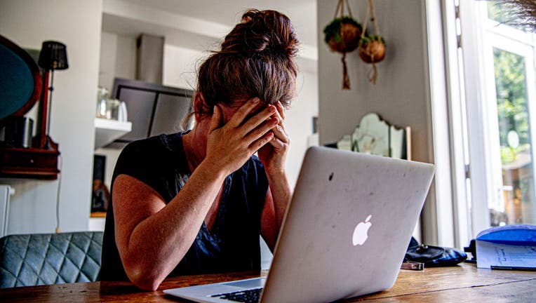 In this photo illustration a woman appears to be stressed as