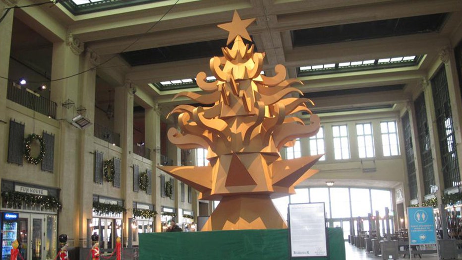 Christmas tree made of cardboard inside convention hall on boardwalk