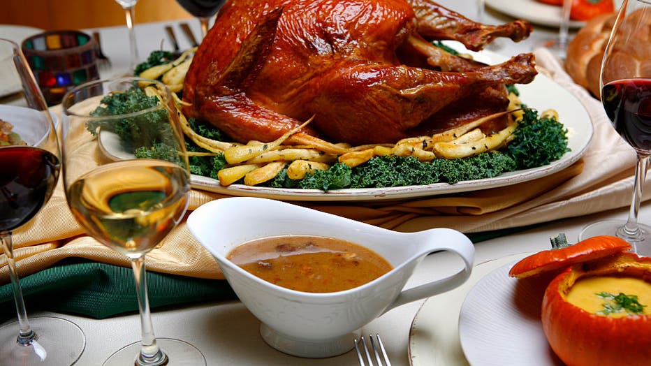 e2ac3216-Saltrubbed, roasted turkey with roasted parsnips, pan sauce, center and spiced pumpkin soup with m