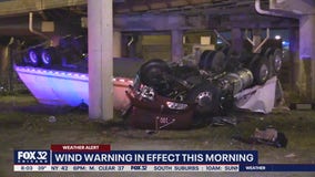 Strong winds force semi to fall from overpass onto street below in Chinatown