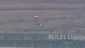 US Navy elite paratroopers parachute into MetLife Stadium ahead of Army- Navy game