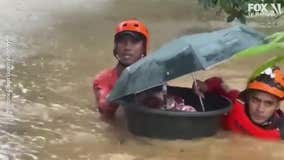 Typhoon hits Philippines; crew rescues infant from floodwaters