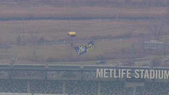 US Navy elite paratroopers parachute into MetLife Stadium ahead of Army- Navy game